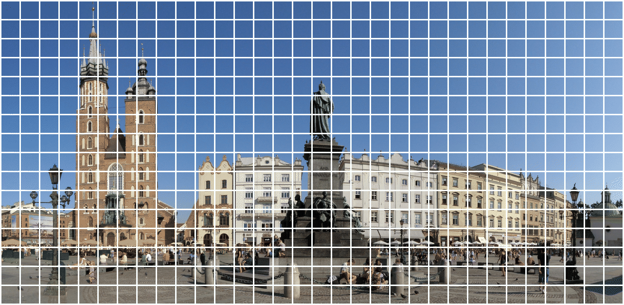 Krakow's Main Square split into 512 tiles, a wavefront sweeping across it turning sharp colour tiles into blurry black and white, tile by tile